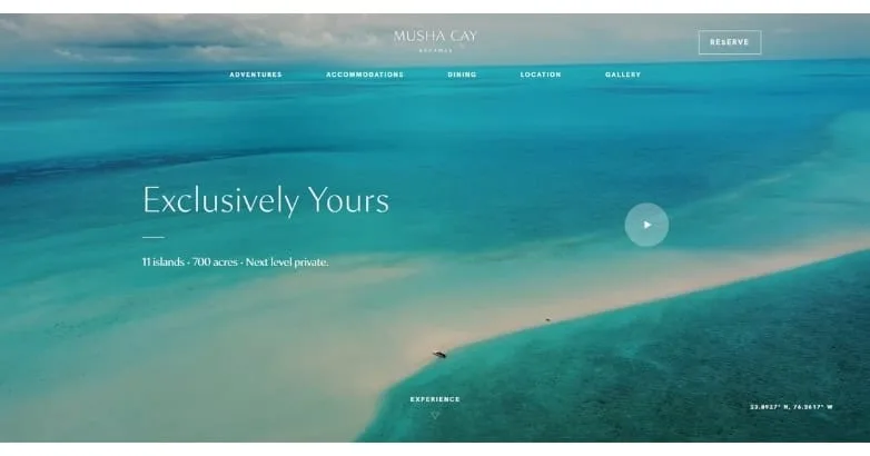 Musha Cay private island homepage with an Exclusively Yours hero over turquoise water